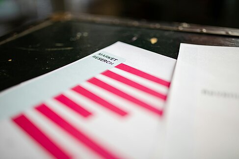 Folder labelled ‘Market Research’. Image under licence Pexels.