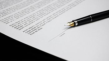 Pen on a contract. Image under licence Pixabay