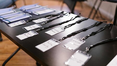Conference badges on a table. Image under licence Pexels